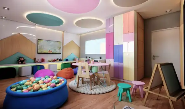 Brinquedoteca com piscina de bolinhas, mesas infantis e armários coloridos